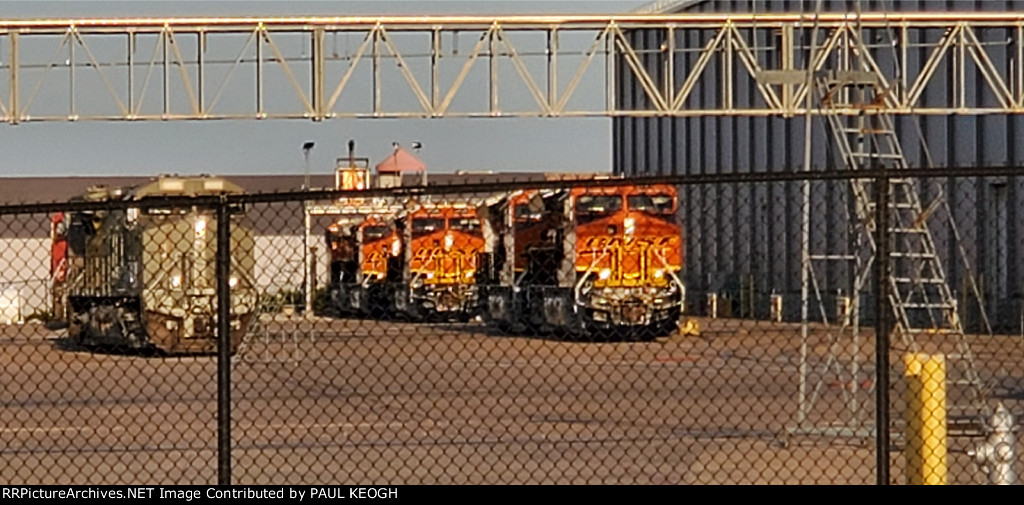The Setting Texas Sun Reflects Off The Very, Very, Very Brand New BNSF Swoosh Logo Paint Scheme's and Primered Locomotives at The Wabtec Locomotive Plant Fort Worth Texas. 